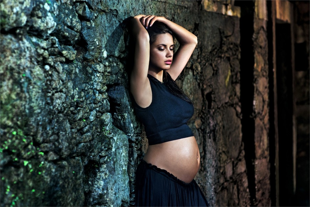 Brazilian mother-to-be, Adriana Lima poses against  stone wall in Rio de Janeiro for the Pirelli The Cal™.